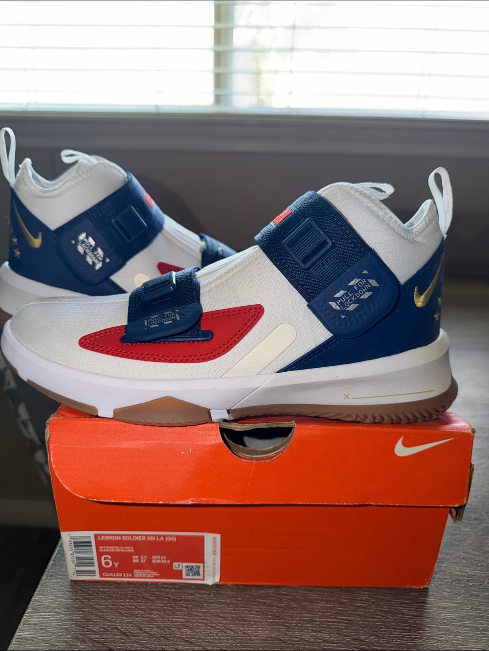 Nike Kids White Navy Blue and Red Athletic Sneakers with Gold Swoosh